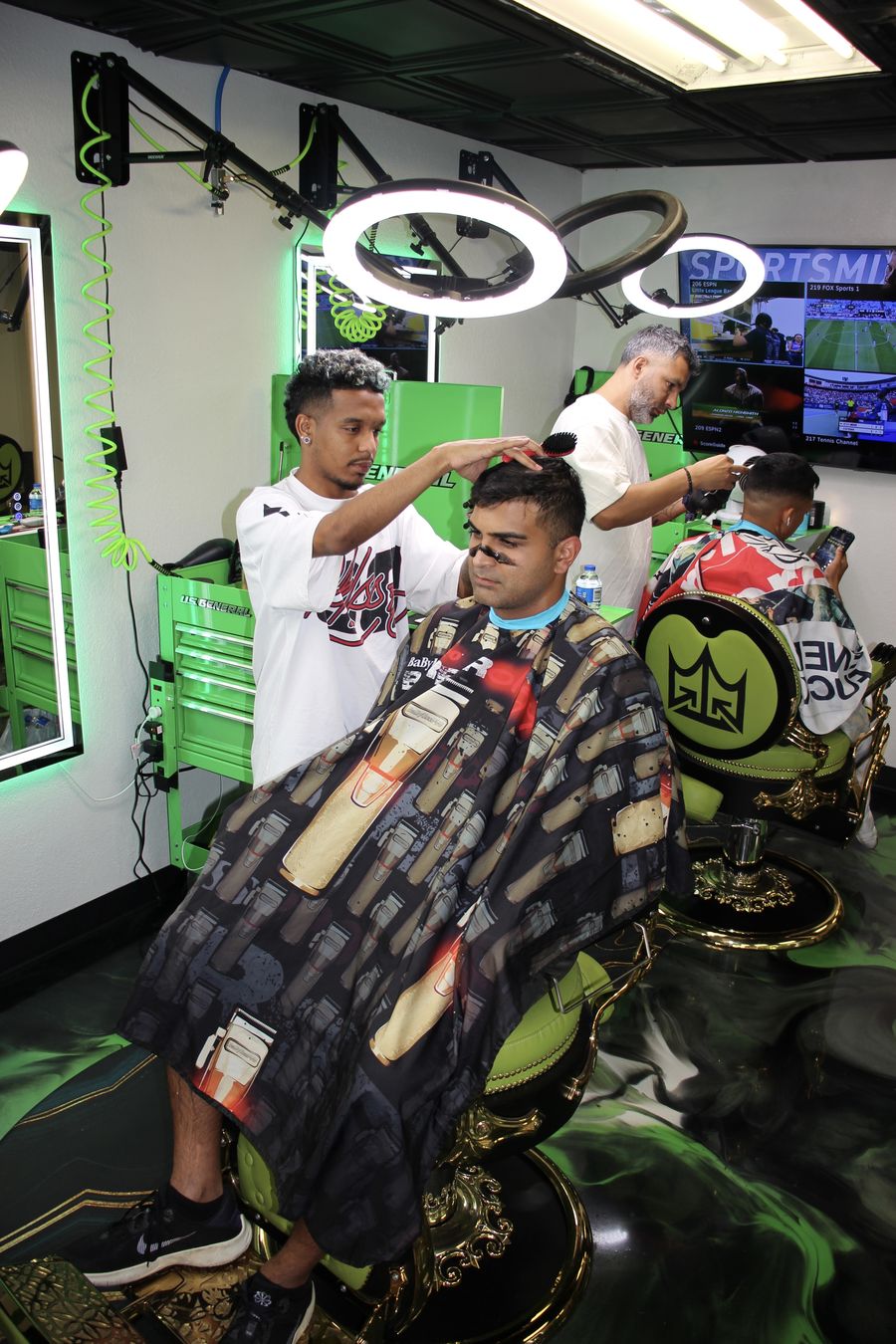 Barber cutting under ring lights