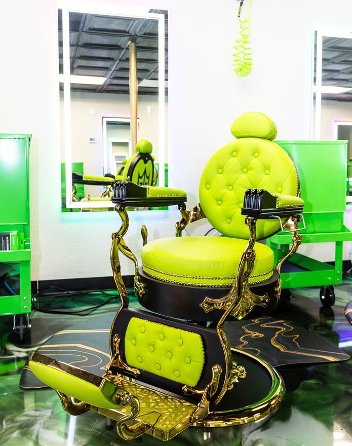 Signature green and gold barber chair close-up